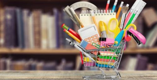Stationery objects in mini supermarket cart Stationery objects in mini supermarket cart